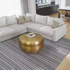 Table basse ronde Urban Port 32" style tambour artisanal en aluminium texturé martelé et estampé laiton antique