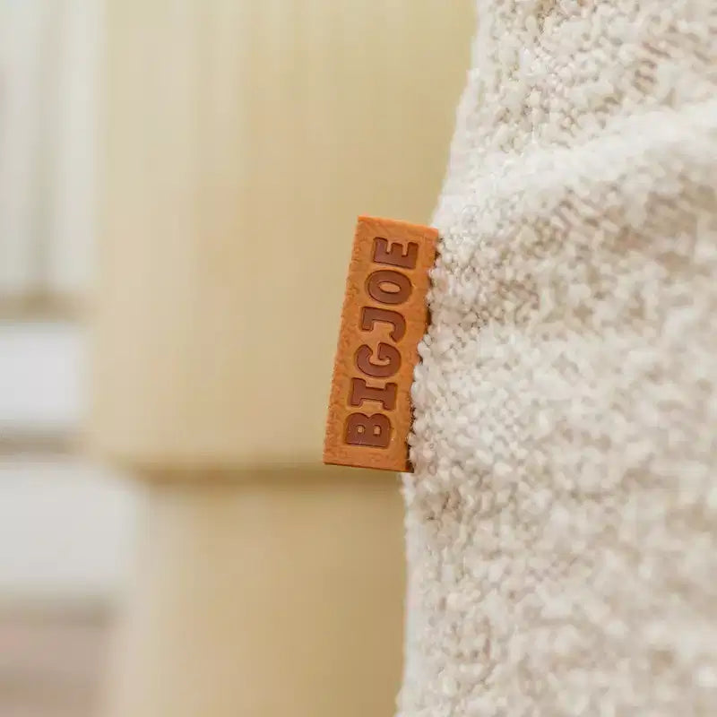 Grand transat Big Joe Delmont, pouf garni de mousse, cuir végétalien ou bouclé, pour tous les âges